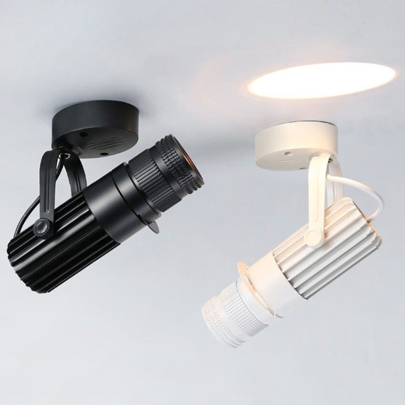 Black and white ceiling lights on a light gray background