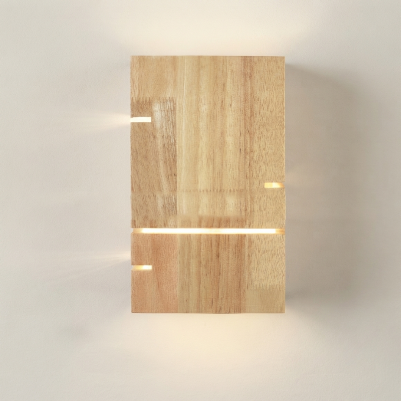 A modern rectangular wall sconce made of light natural wood with integrated horizontal LED light bars, casting a warm glow against a neutral off-white background.