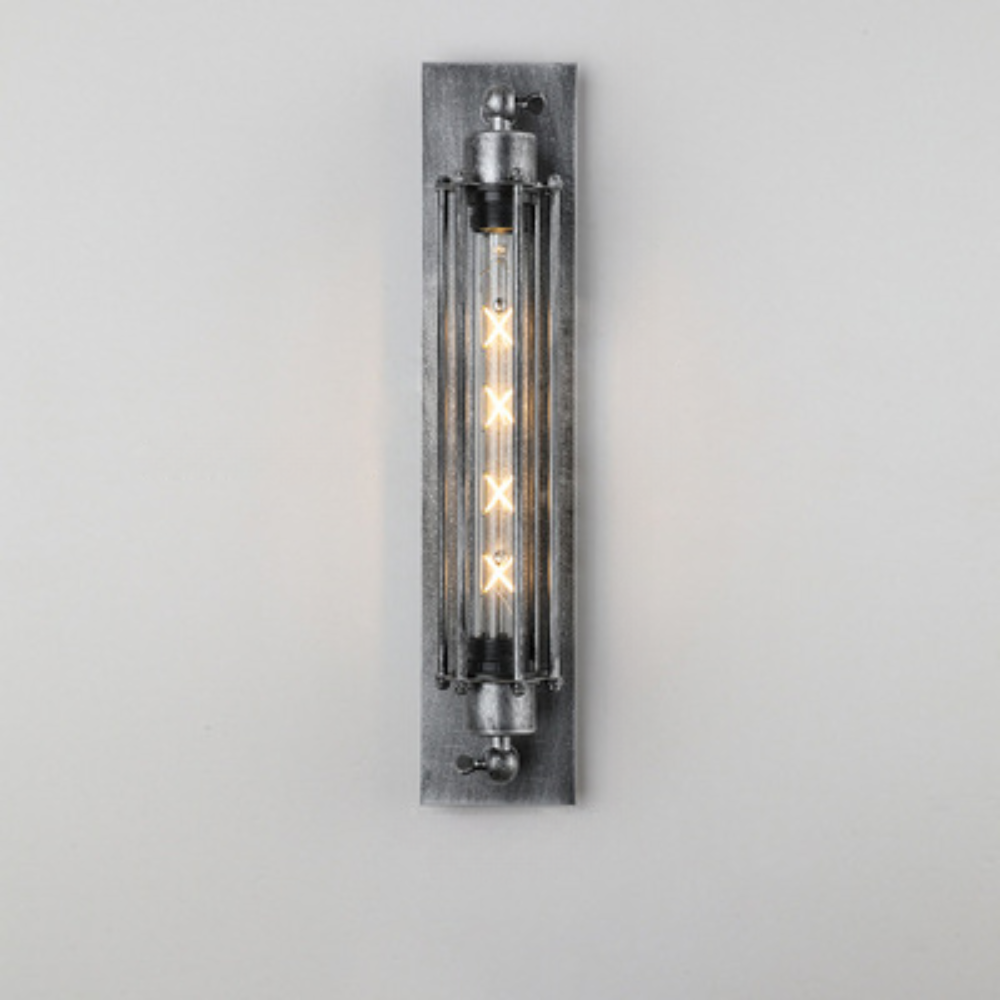 Wall-mounted industrial-style light fixture with clear glass cover on a gray background