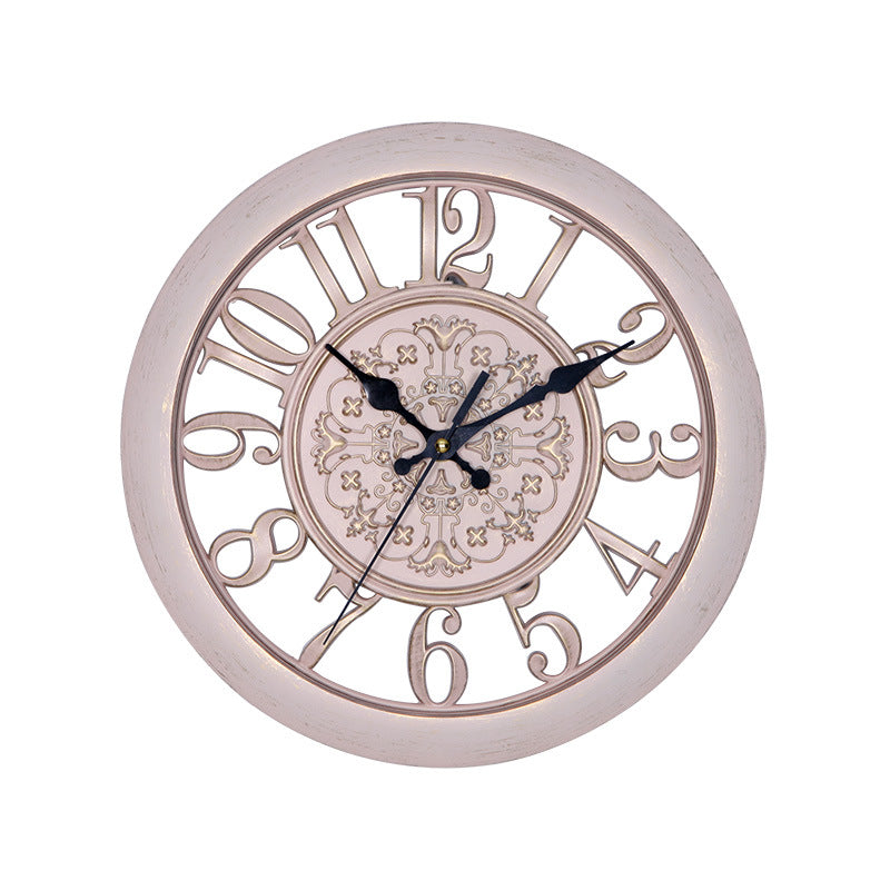 Decorative wall clock with intricate design on a white background