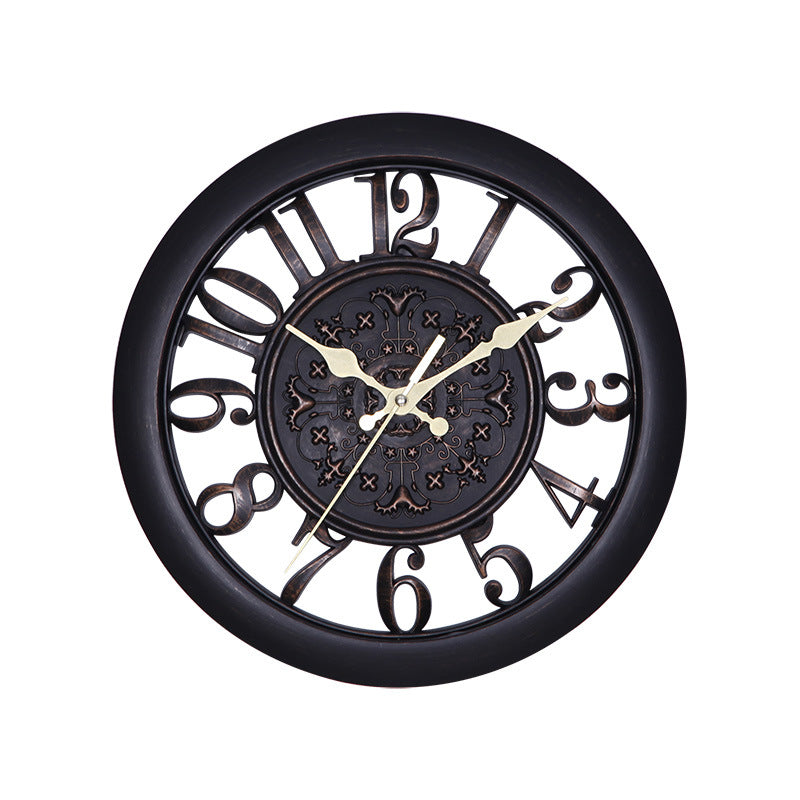 Decorative wall clock with black frame and gold hands on a white background