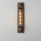 Vintage-style wall sconce with metallic finish on a plain background