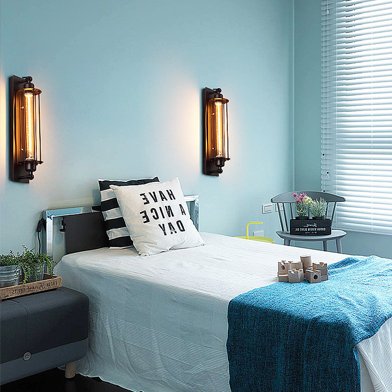 Modern bedroom with light blue walls, a bed with decorative pillows, and wall sconces.