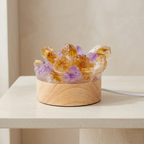 Crystal lamp with wooden base on a light surface