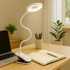 Spiral desk lamp on a table with a laptop, notebook, and pencils in a home office setting.