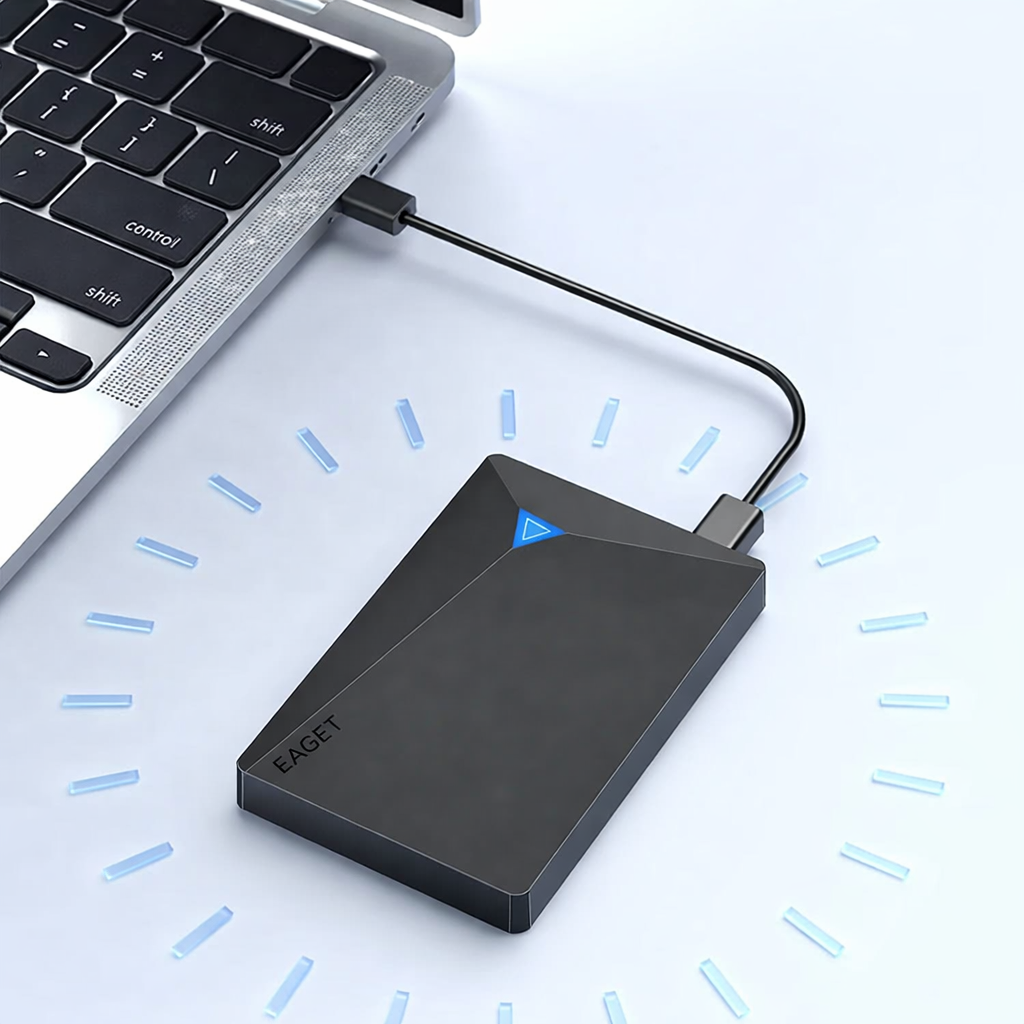 Black external hard drive connected to a laptop on a light blue background