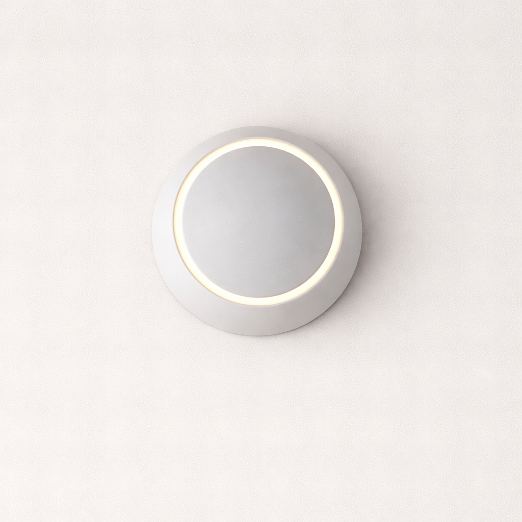 Round wall light fixture on a white background