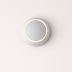 Round wall light fixture on a white background