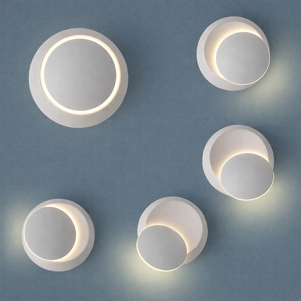 Five circular wall lights on a gray wall