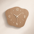 Wooden wall clock with a unique shape on a beige background