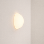 Round wall light fixture on a plain white background