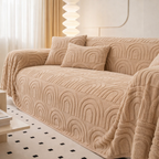 Beige textured sofa cover on a couch in a modern living room.