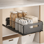 Kitchen cabinet organizer with jars and containers on a neutral background
