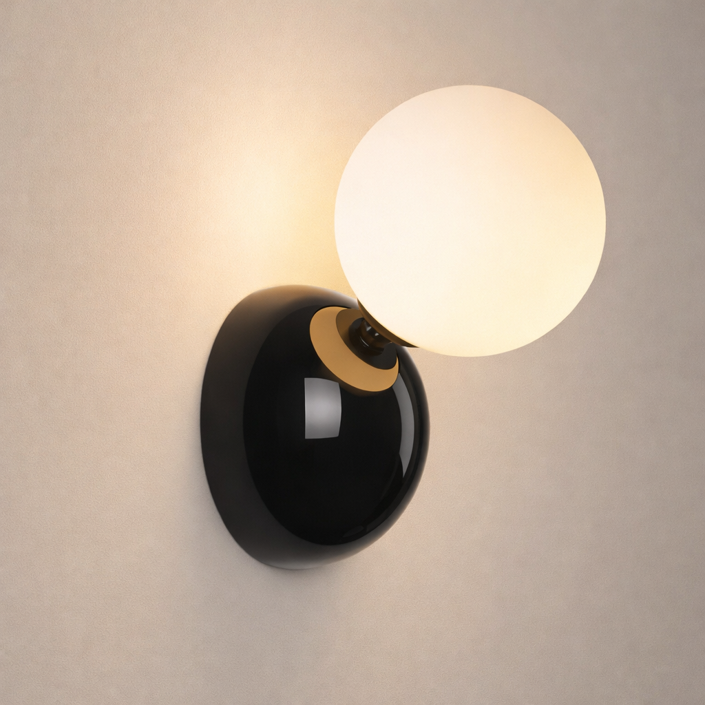 Wall-mounted light fixture with a black base and white glass shade on a neutral background