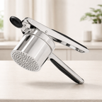 Handheld shower head on a light wooden surface with a blurred background