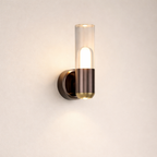 Modern wall-mounted light fixture with glass shade on a neutral background