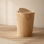 Wooden trash can on a wooden floor with a neutral background