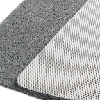 Close-up of a gray textured mat with two sides visible: a coarse looped top surface and a smoother white mesh backing.