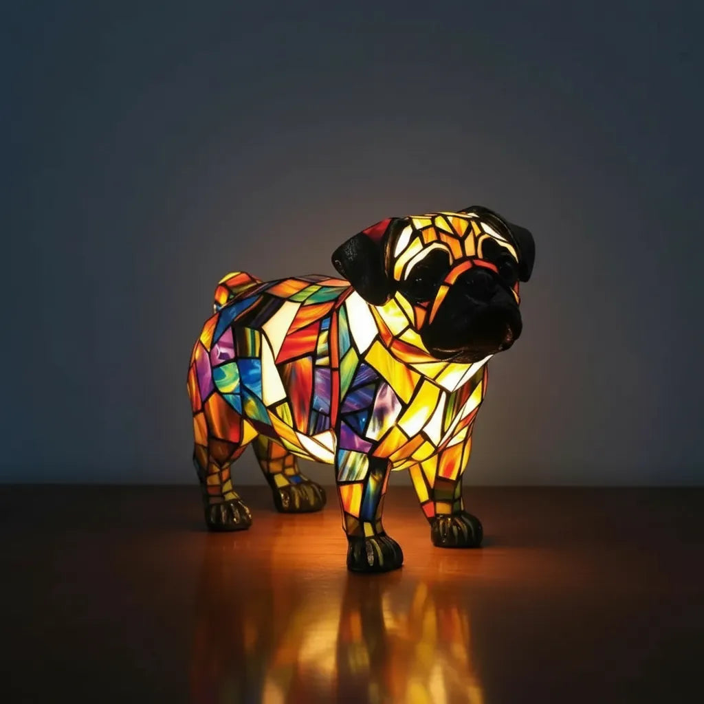 Colorful stained glass pug dog sculpture on a dark background