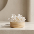 Crystal lamp with wooden base on a neutral background