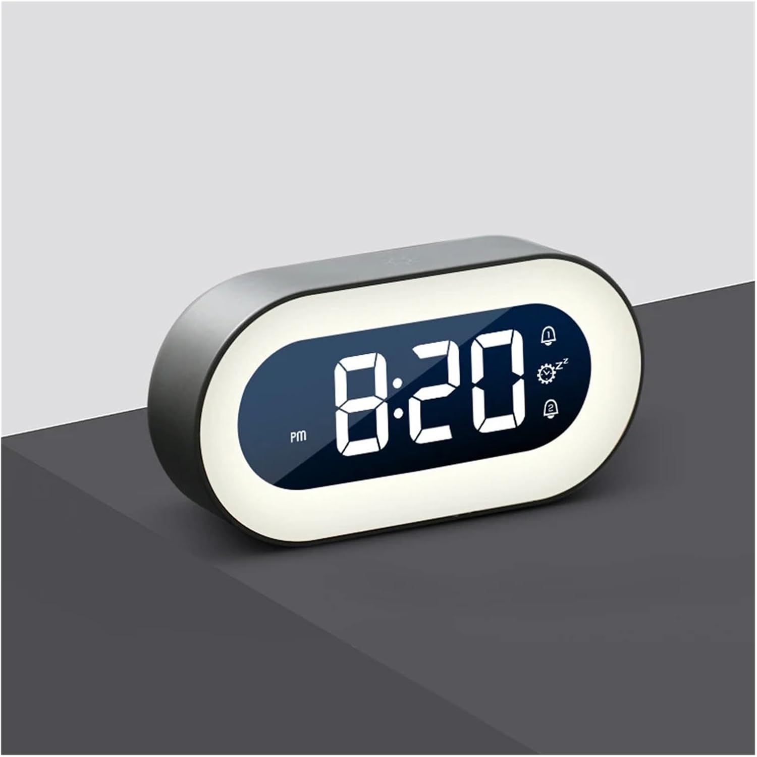 Digital clock with LED display on a gray surface