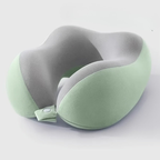 A U-shaped travel neck pillow with a dual-tone design featuring a light sage green exterior and a gray interior, shown on a clean white background.