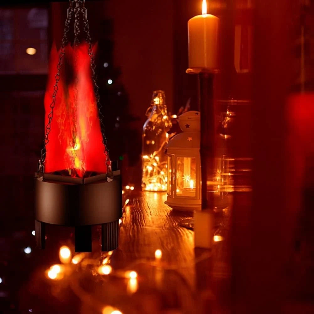 Decorative setup with a red flame effect, candles, and lanterns on a dark background.