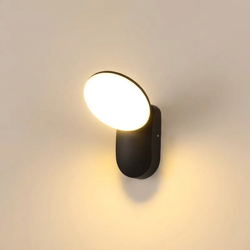 Modern wall-mounted light fixture on a plain wall