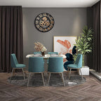 Modern dining room with teal chairs, a round clock, and decorative elements.
