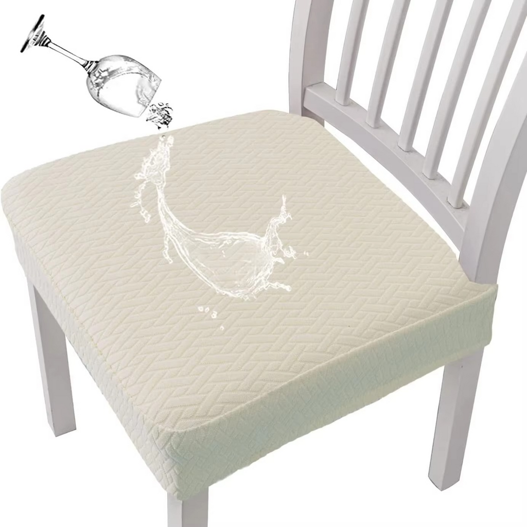 Cream-colored seat cover on a chair with a glass of water being poured onto it.