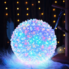 Decorative LED light ball with floral pattern on a dark background
