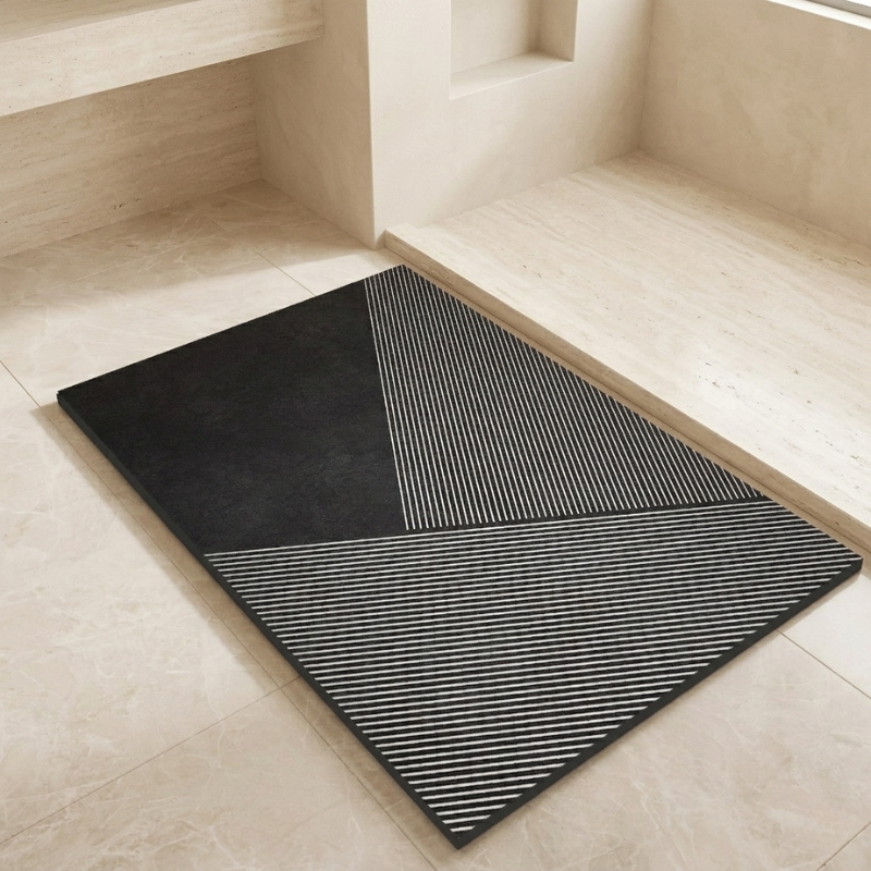 Black and gray patterned rug on a light wood floor
