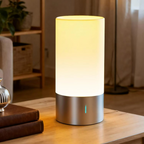 Table lamp on a wooden surface with a cozy indoor setting