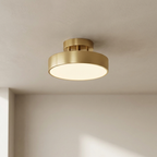 Gold ceiling light fixture on a neutral ceiling