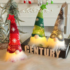 Three colorful LED gnome lights on a surface with a decorative background.