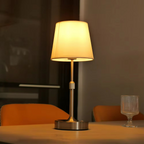 Table lamp on a wooden table with a blurred background