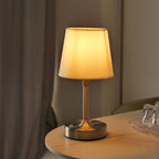 Table lamp on a wooden table with a blurred background