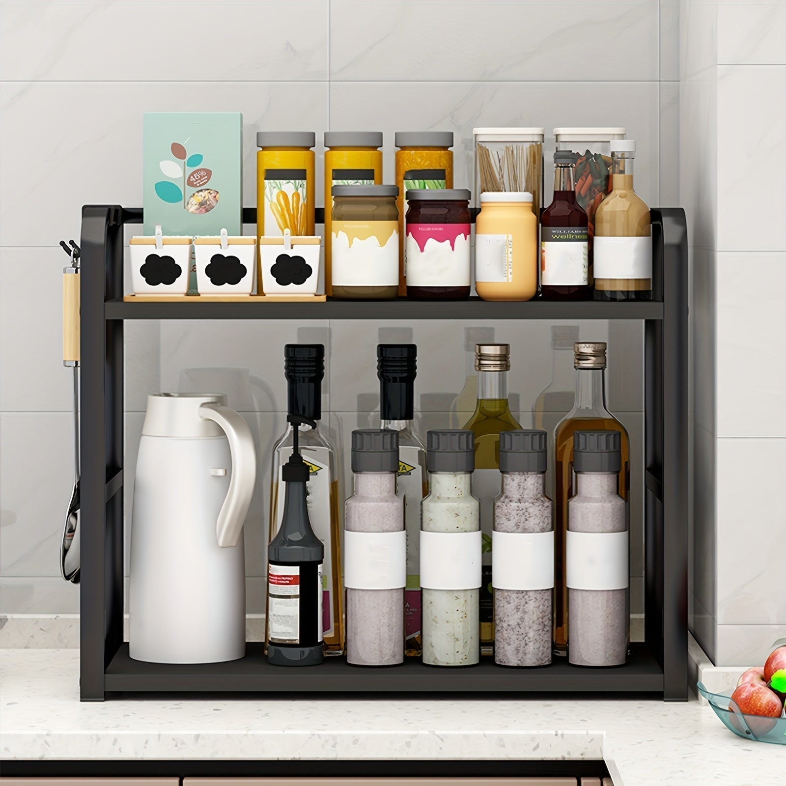 Kitchen shelf with various bottles and containers on a tiled wall background