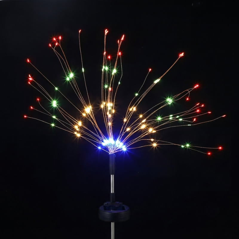 A solar-powered fiber optic light pole with a burst of multicolor lights, including red, green, yellow, and blue, set against a solid black background.