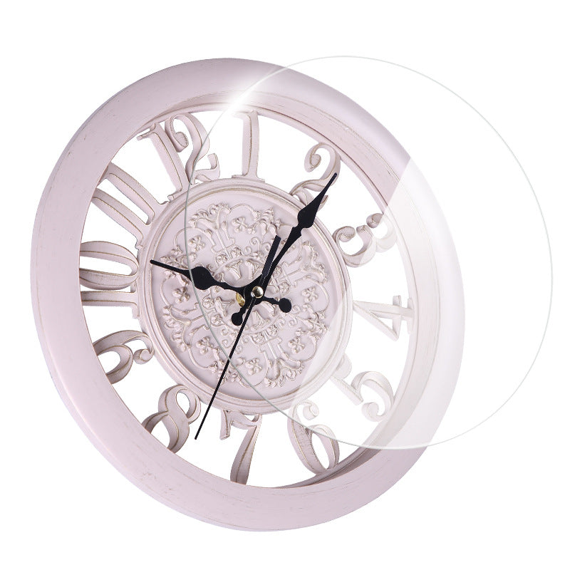 Decorative wall clock with intricate design on a white background