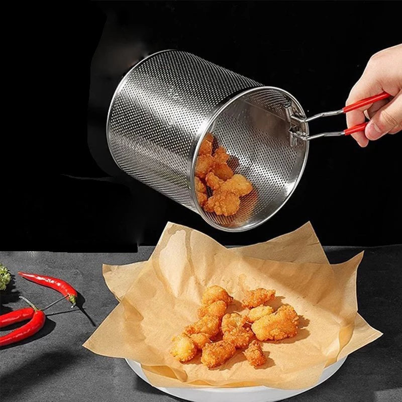 Metal strainer being used to transfer fried food onto a paper towel-lined plate.