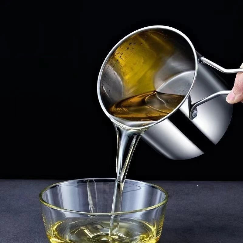 Spoon pouring oil into a glass bowl with a dark background