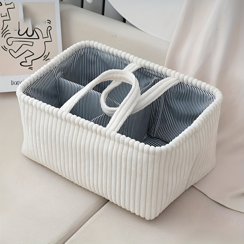 White woven storage basket with a striped liner on a light-colored surface.