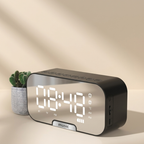Digital clock with LED display on a beige background
