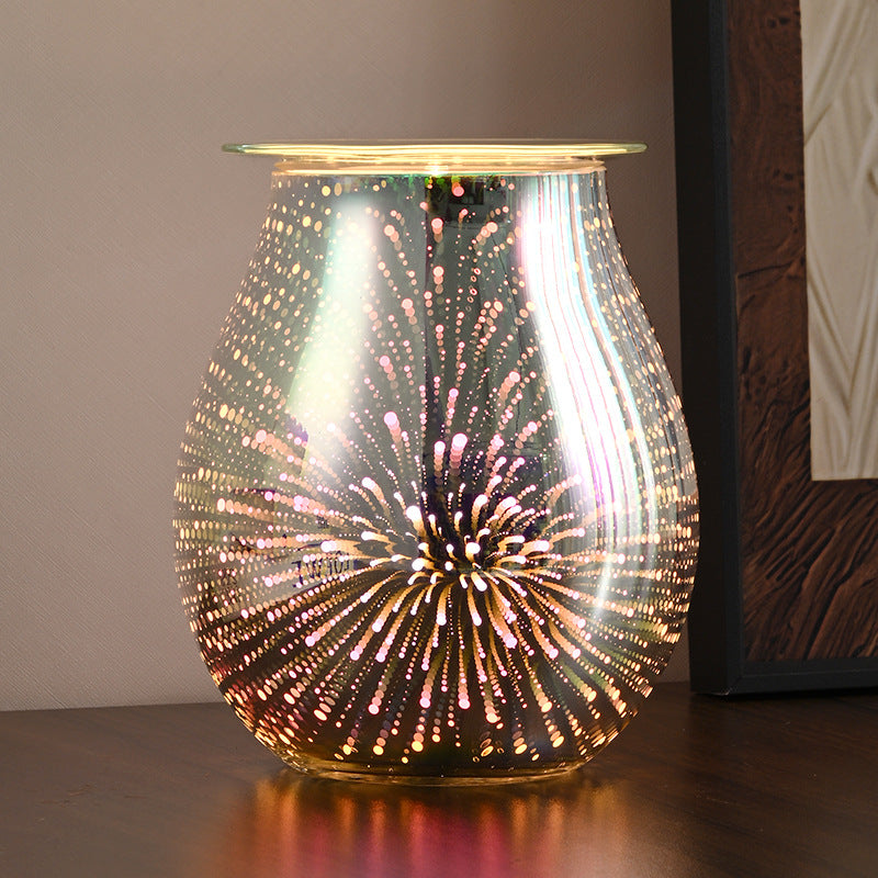 Decorative lamp with a firework design on a wooden surface.