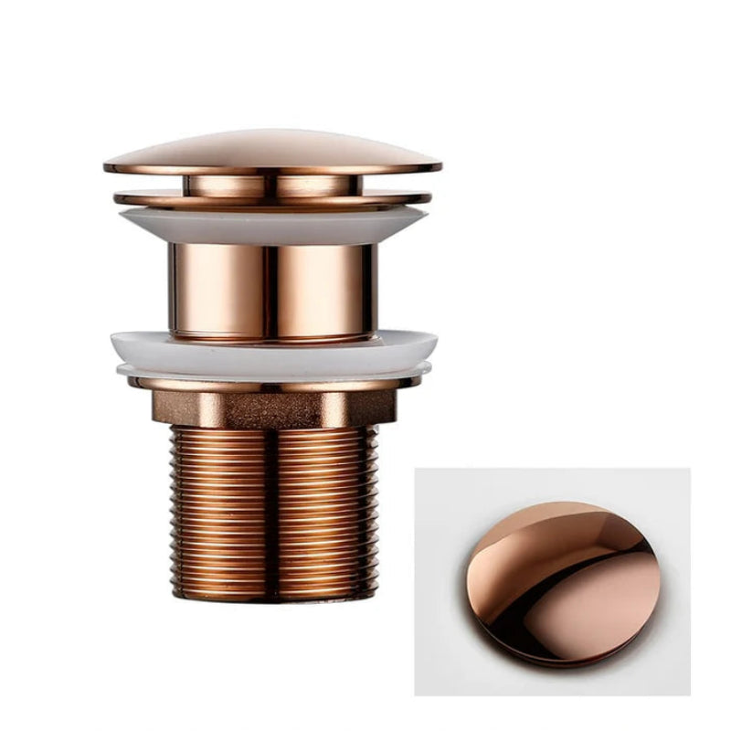 Rose gold sink drain with overflow on a white background