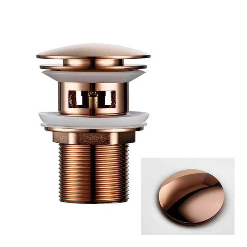 Rose gold bathroom drain with overflow on a white background