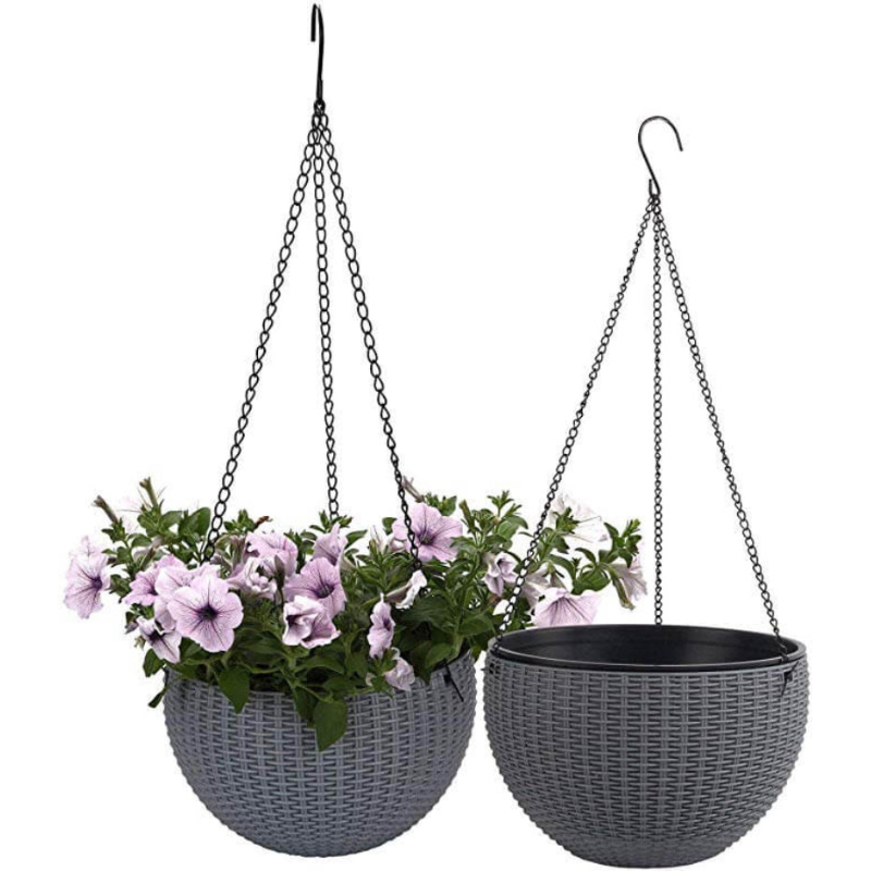 Two hanging flower pots with plants on a white background