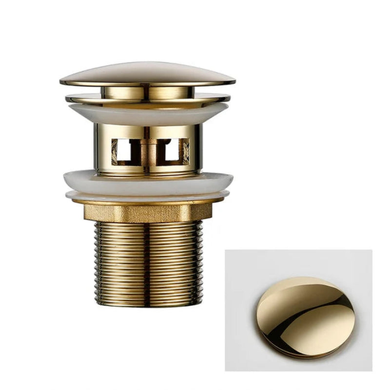 Gold-colored drain plug with overflow feature on a white background
