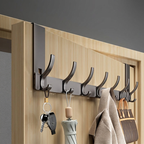 Wall-mounted hook rack with keys, umbrella, and bags on a wooden door.
